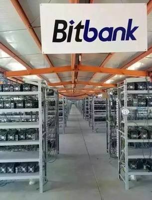 Mining farm in a cold climate location with racks of mining rigs.